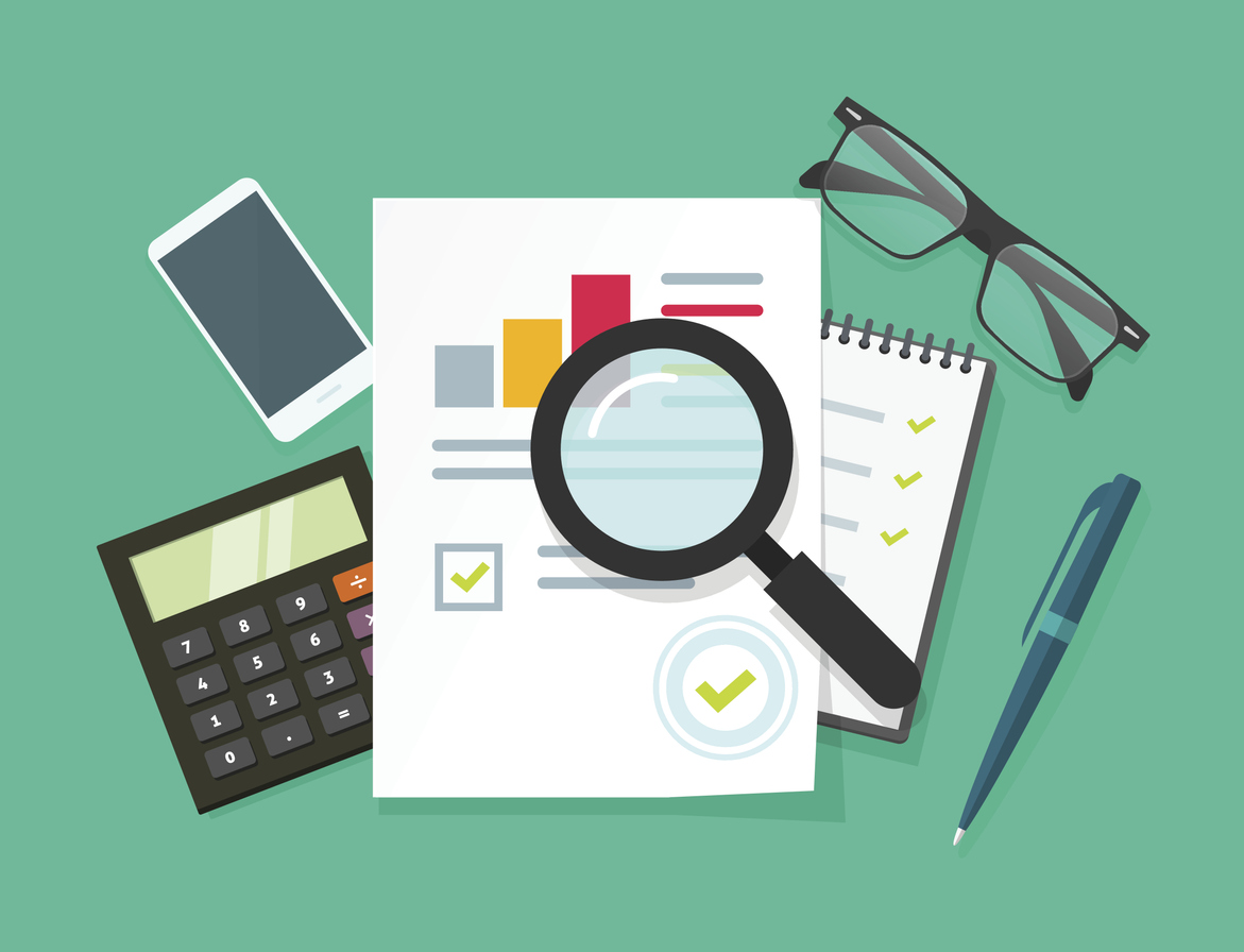 Illustration of a magnifying glass examining financial documents, charts, and checklists on a desk.